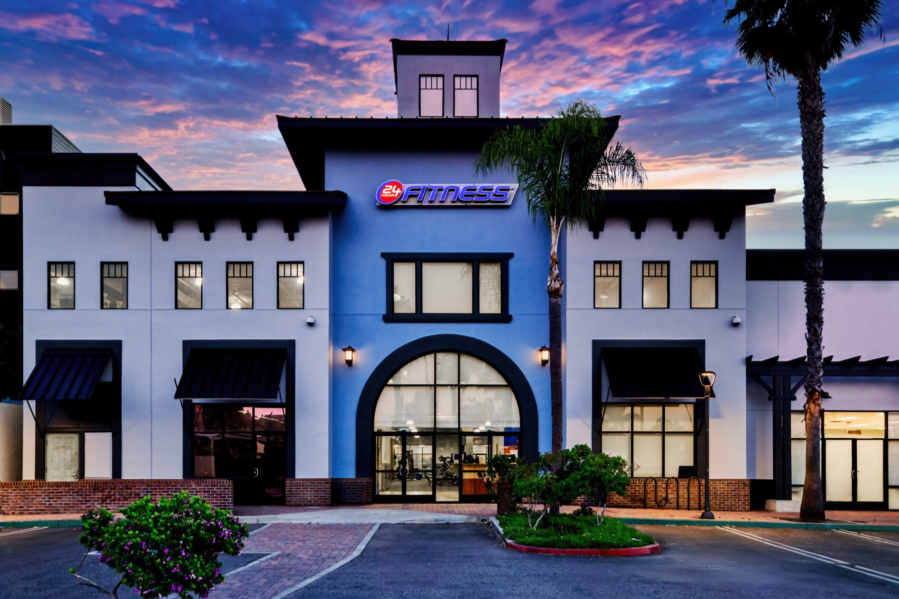 24 Hour Fitness club exterior at dusk